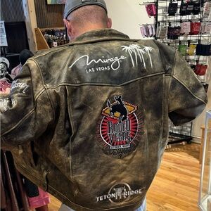 Brown distressed leather Rodeo Vegas jacket by STS, features embroidered logos.